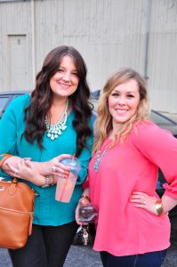 Jenn & Stephanie wearing teal and coral with statement necklaces!