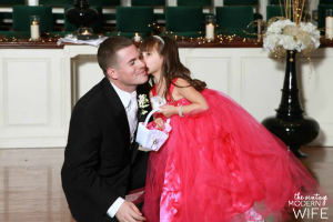 This picture from The Vintage Modern Wife's blog is too cute! The flower girl kissing the groom is one picture I definitely need at my wedding!