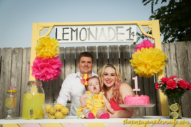 Looking for a lemonade themed 1st birthday photo shoot? This one from The Vintage Modern Wife is TOO cute. With the perfect lemonade stand and props, this lemonade 1st birthday party set up is sweet as can be! The lemonade stand is so perfect too!